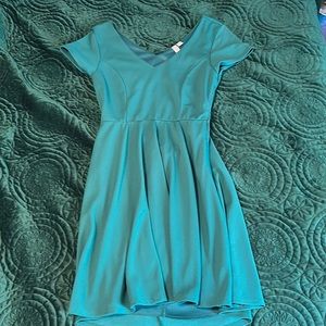 Dark teal fit and flare dress with cut out back